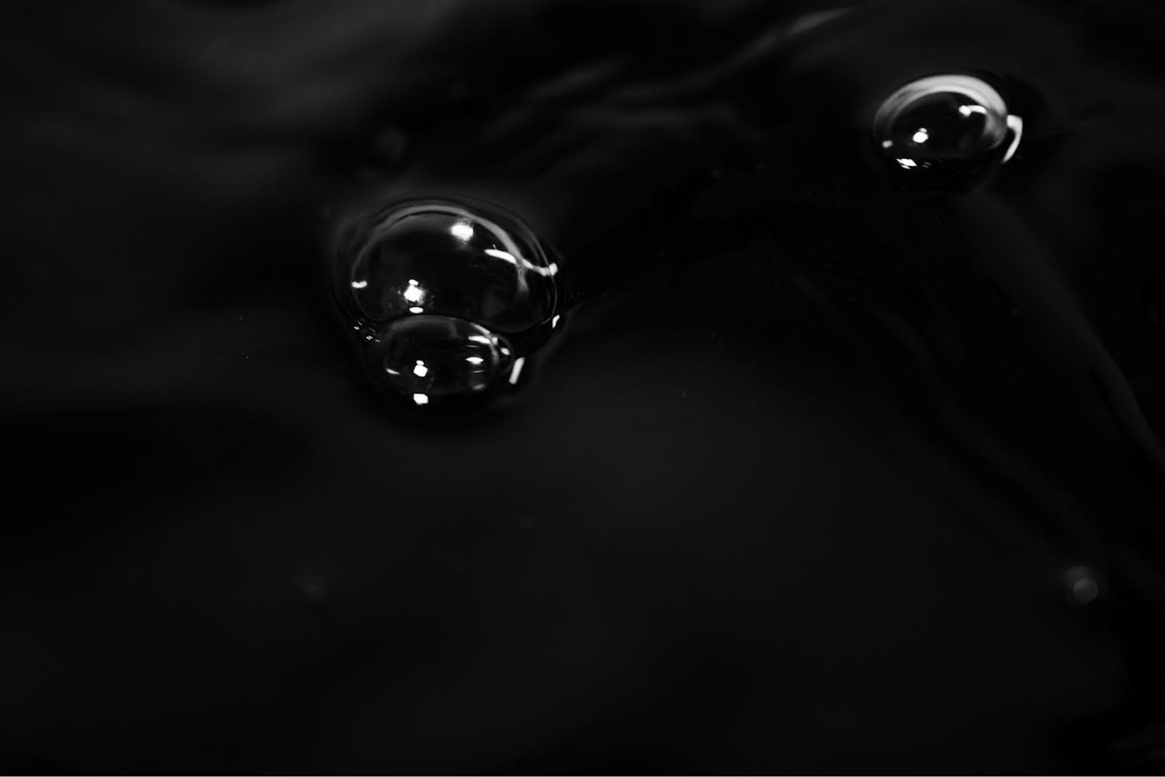 Bubbles on dark surface, black and white
